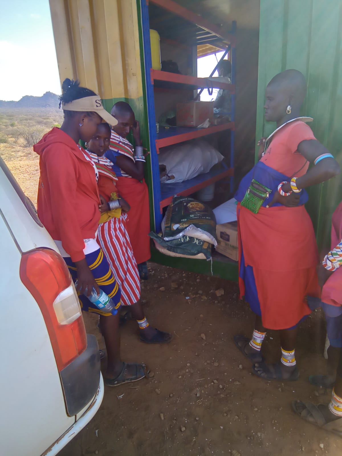 Women purchasing affordable food at a Dukawala shop in rural Kenya
